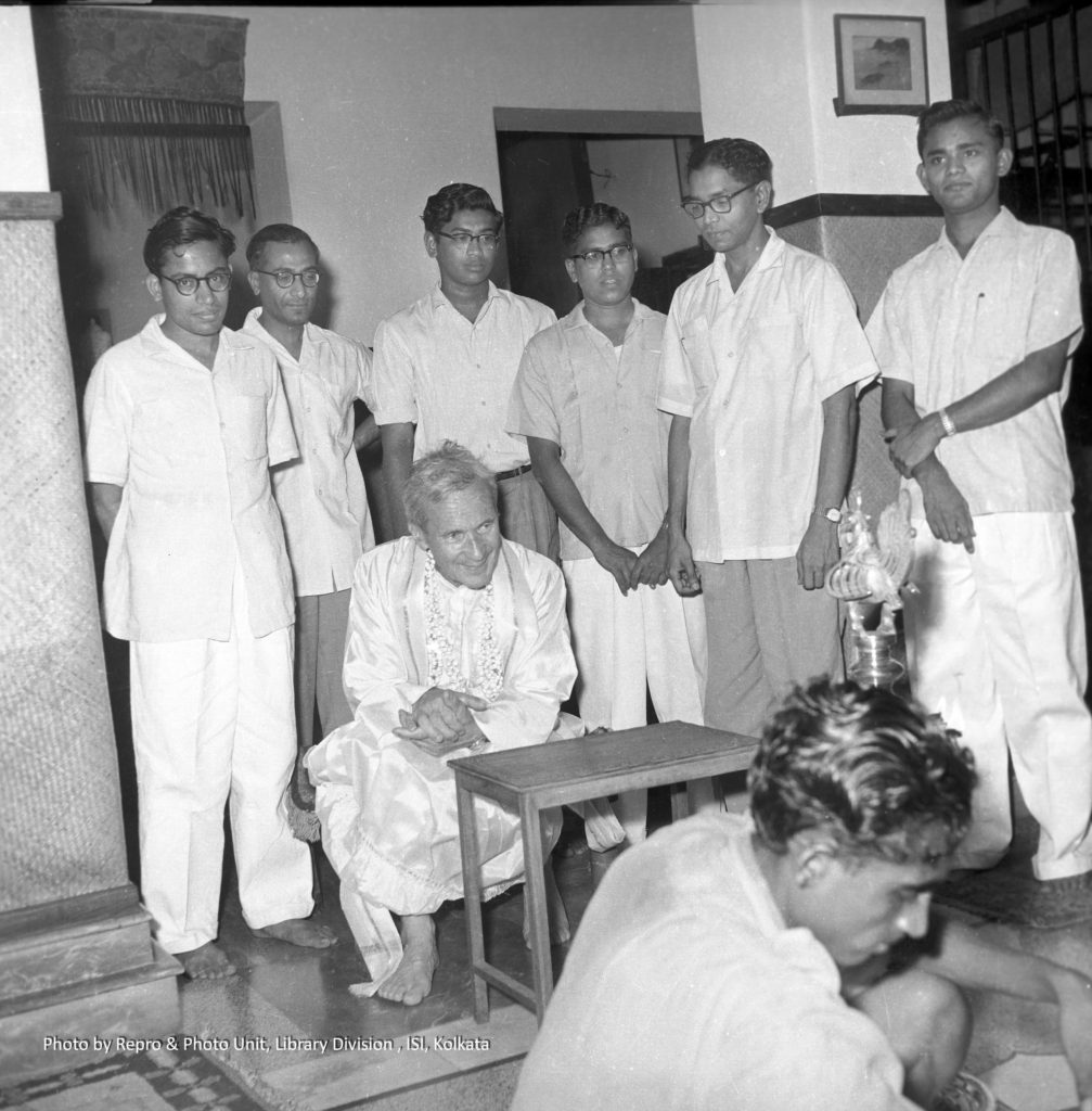  A.N. Kolmogorov dressed in dhoti and kurta. Standing behind him (from l to r): KRP, B.P. Adhikary,SRSV, J. Sethuraman, C.R. Rao and P.K. Pathak. Lighting the lamp is I.M. Chakravarti