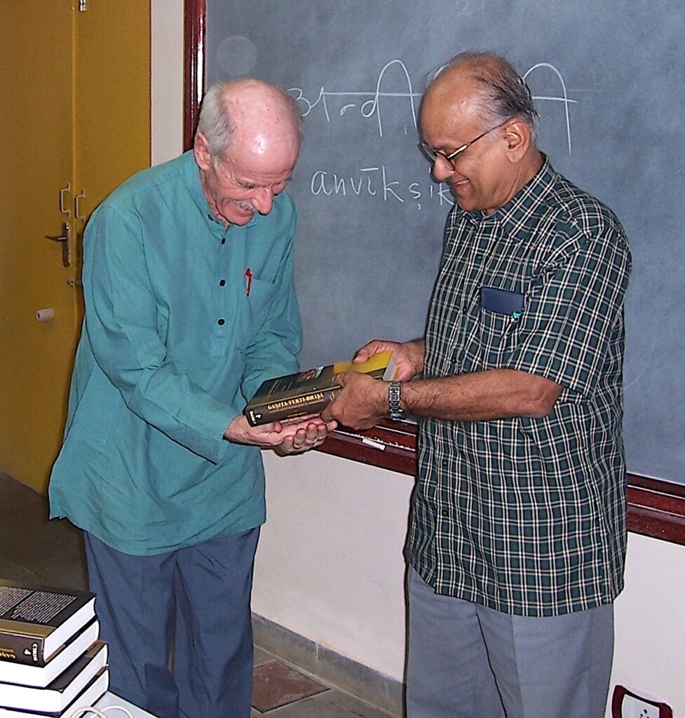 Frits Staal receiving a copy of Gaṇita-Yukti-Bhāṣā from Seshadri