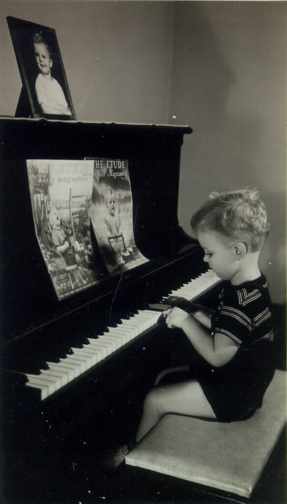 2 year-old Don at the piano on which his father used to teach students; 1940