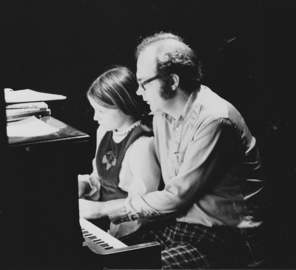 With daughter Jennifer in Stanford, playing at the same piano from his Milwaukee days; 1973