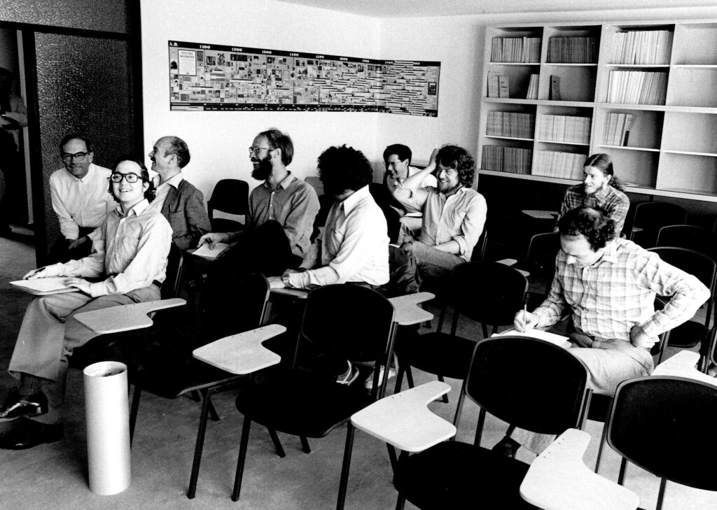 In the lecture room of the old building of MPIM. To his left is Friedrich Hirzeruch, behind him are his close friends Walter Neumann and Matthias Kreck, both of whom were also students of Hirzebruch.