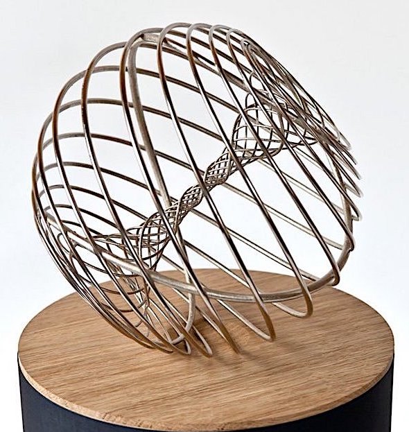 The Breakthrough Prize Trophy in the shape of a toroid, recalling natural forms found from black holes and galaxies to seashells and coils of DNA, created by Olafur Eliasson, explores the common ground between art and science.
