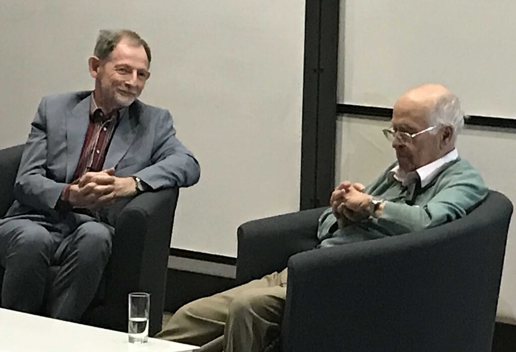 Chairing the discussion after a public lecture of Michael Atiyah at Ball's 70th birthday meeting in Oxford 2018.