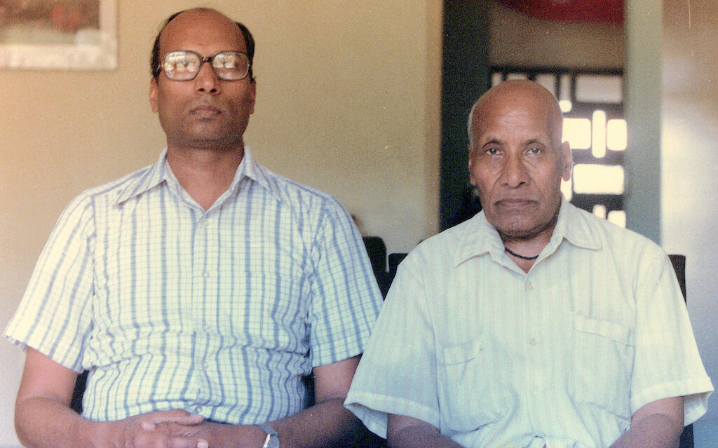 With his father at their Bhaskara apartment.