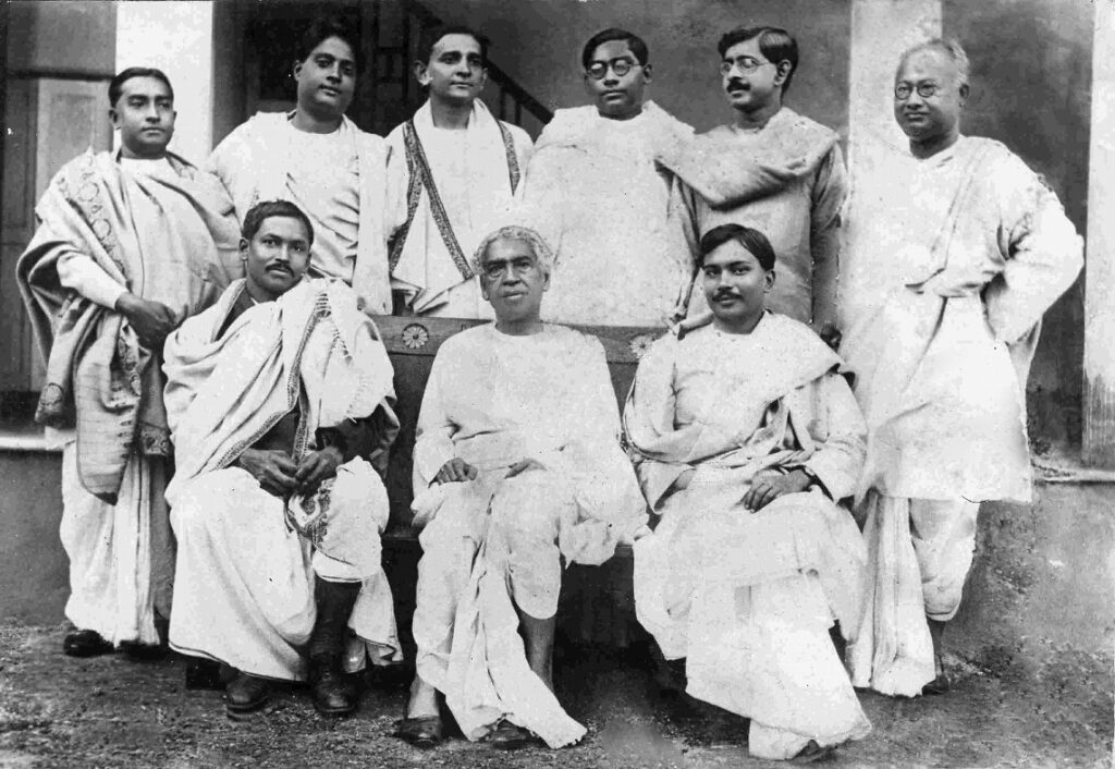 Sir Jagdish Chandra Bose with his students (L to R) Sitting: Meghnad Saha, Jagdish Chandra Bose, Jnan Chandra Ghosh. Standing: Snehamoy Dutt, Satyendra Nath Bose, Debendra Mohan Bose, N.R. Sen, Jnanendra Nath Mukherjee, N.C. Nag.