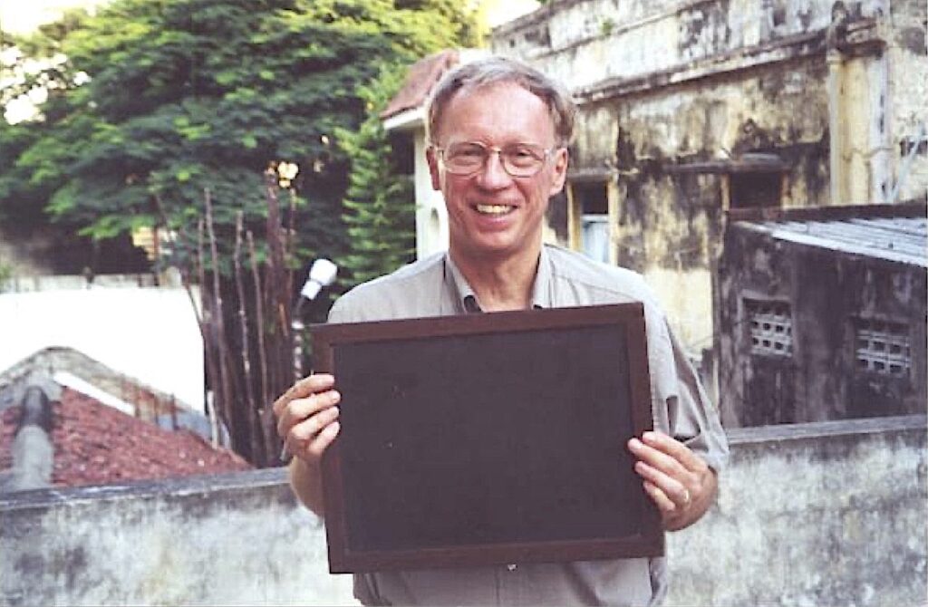 Holding the slate on which Ramanujan scribbled his thoughts, if only to frantically erase them with his elbow, and then quickly refill it all over again with some more calculations.