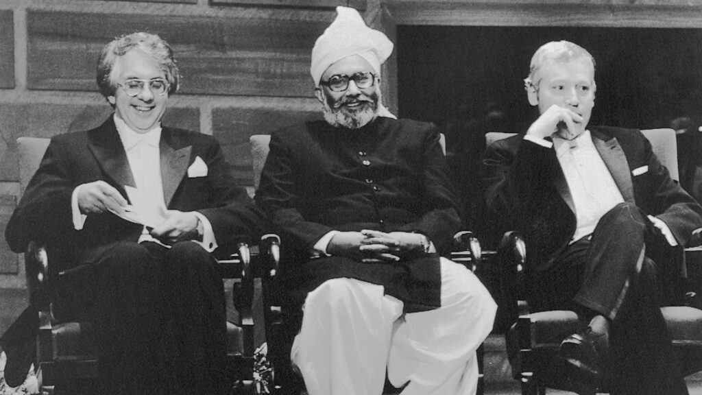 Sheldon Lee Glashow, Abdus Salam and Steven Weinberg seated at the Nobel Prize ceremony.